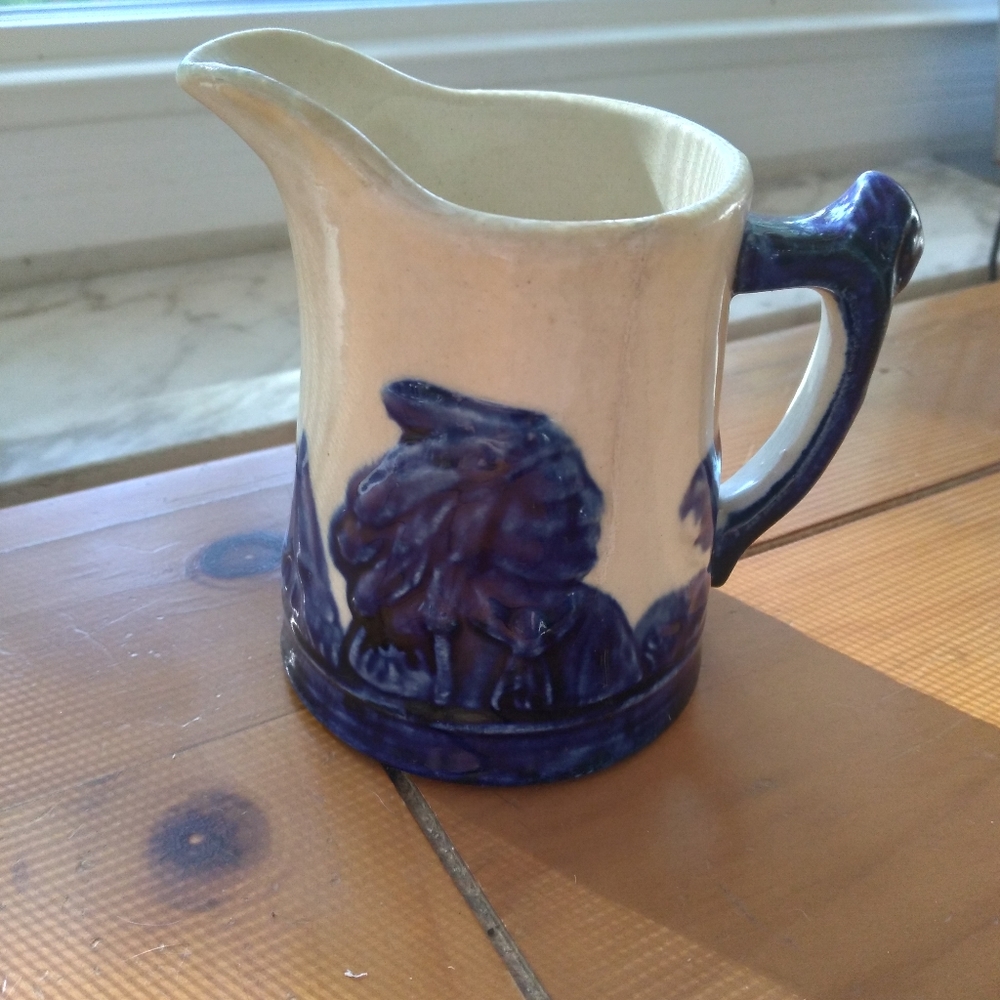 Old Sleepy Eye 1/2 pint pitcher. 4" high.